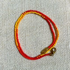 Orange red and yellow monochrome glass bead strand necklace